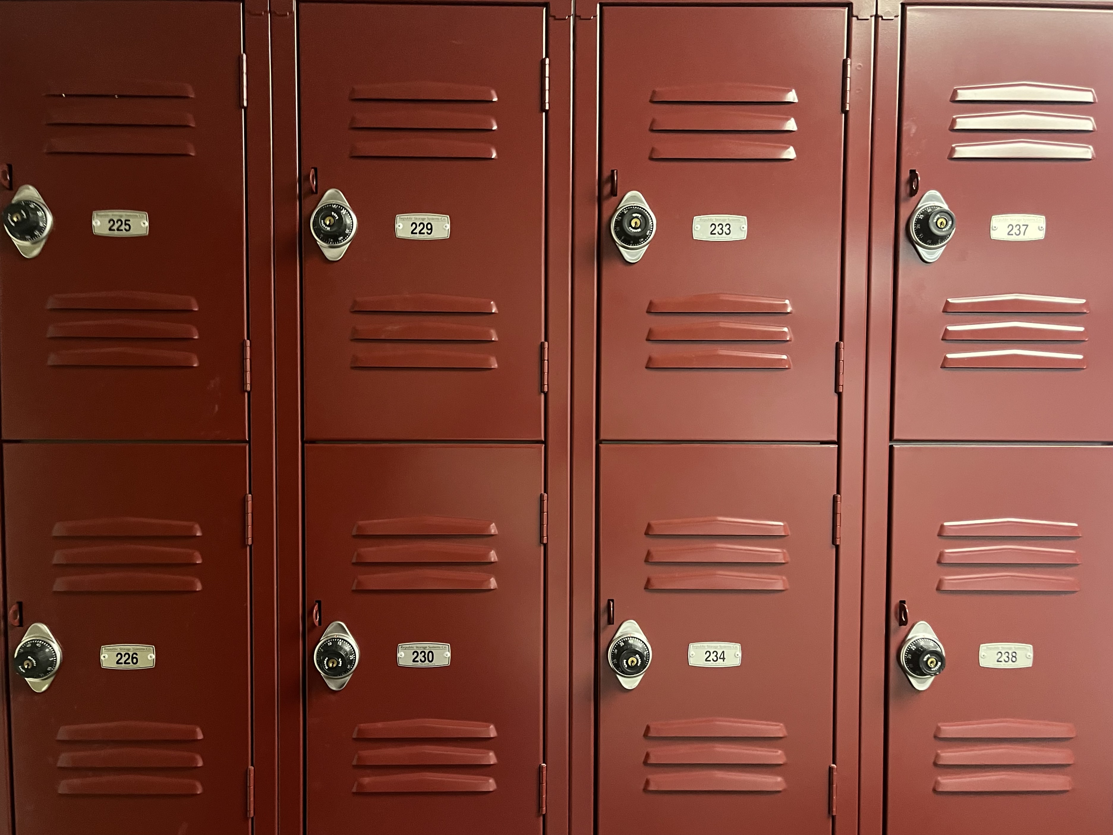 two rows of red lockers with numbers from 225 to 228