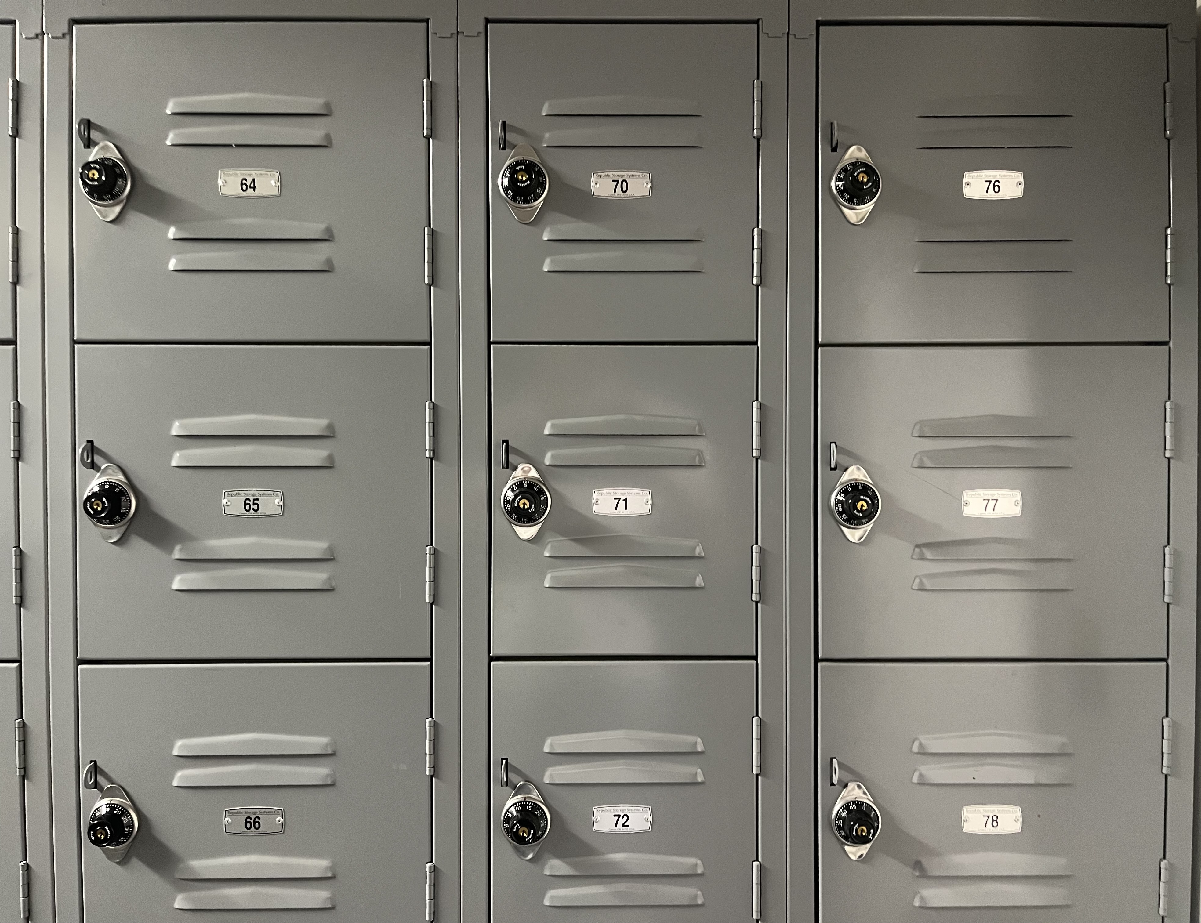 three rows of gray lockers with numbers from 64 to 78.