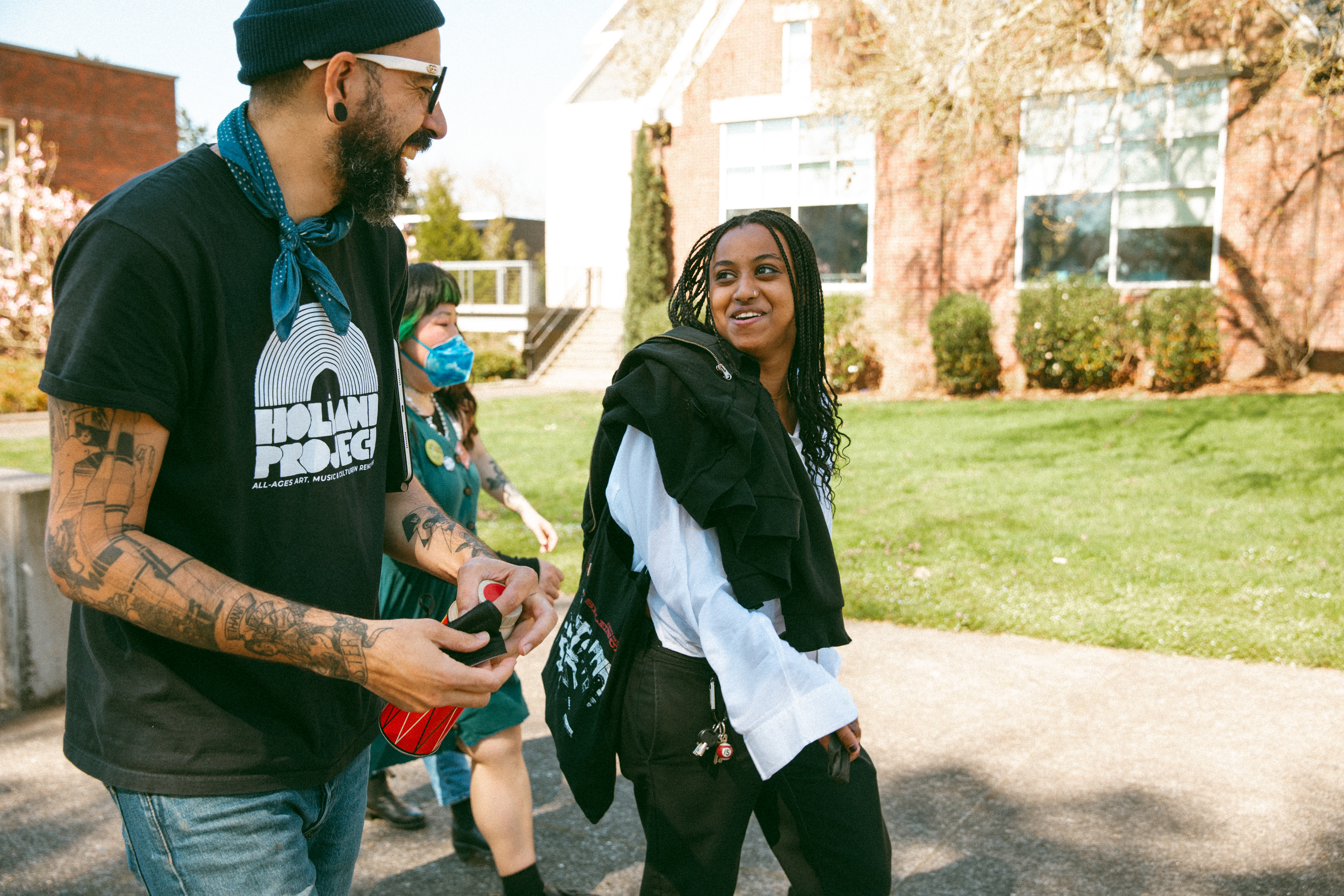 James Spooner, zine fest special guest, chats with student while walking